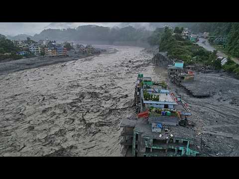 Hundreds of unidentified flood victims ‘temporarily buried’ in Nepal