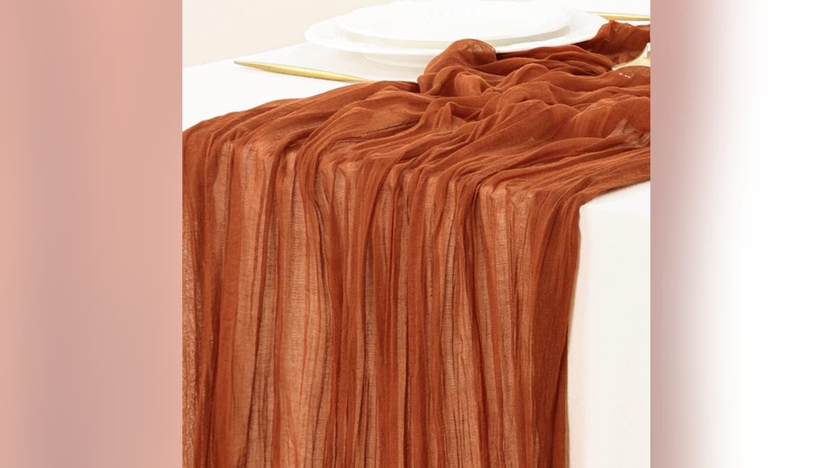 This orange tablecloth is the ideal addition to any Thanksgiving table. 