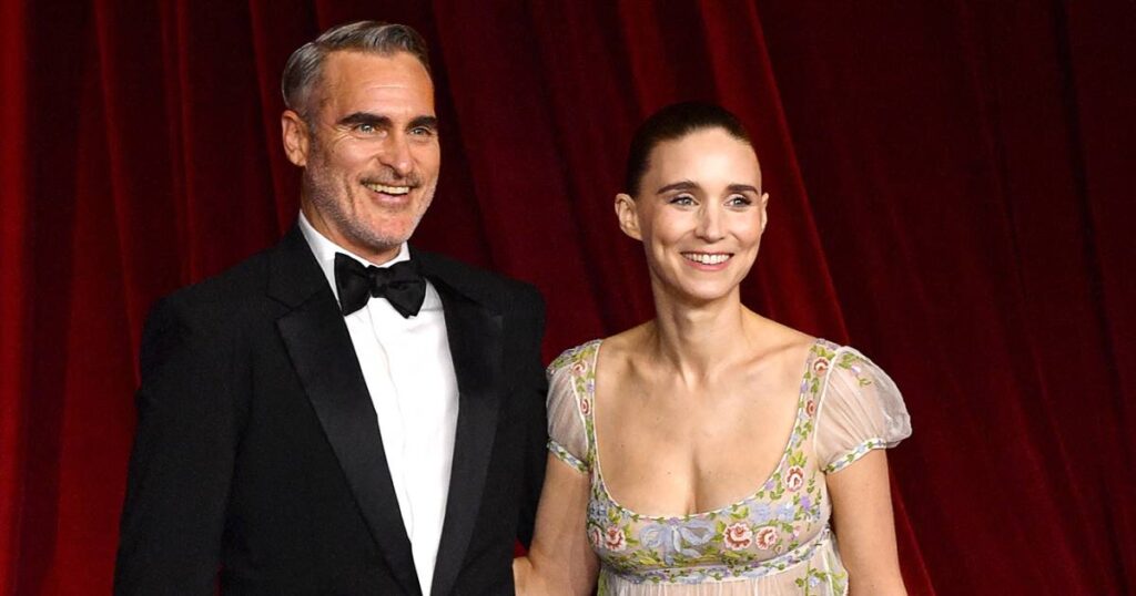 Joaquin Phoenix Adorably Fixes Fiancee Rooney Mara’s Train at Academy Museum Gala