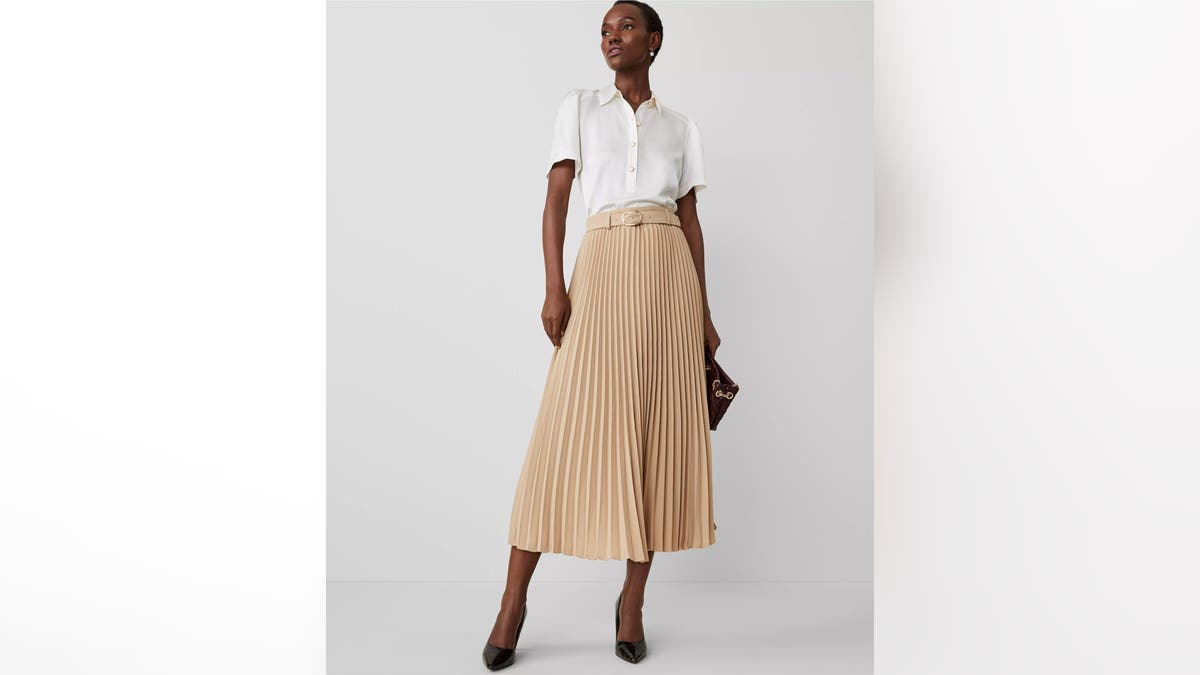 A pleated long skirt is an elegant way to host guests.