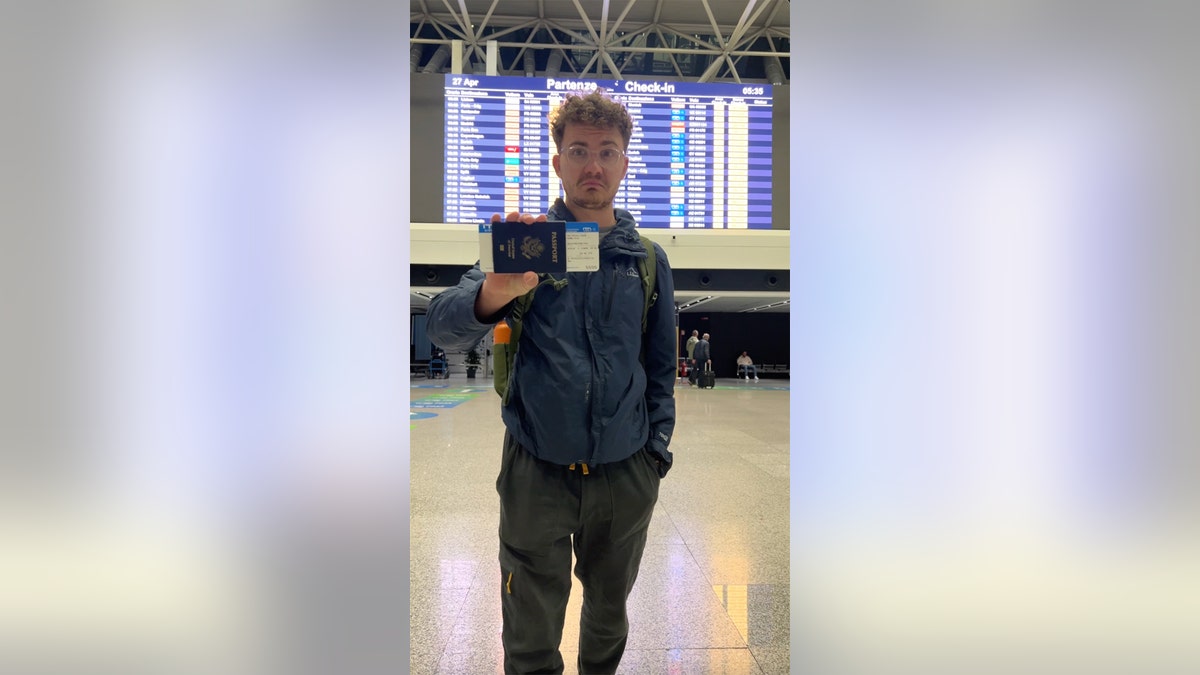 JT with his boarding pass