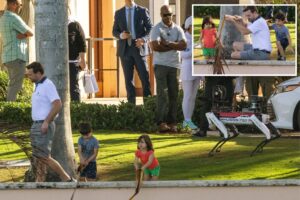 JD Vance plays with his three young kids as robot dog Spot stands guard at Mar-a-Lago