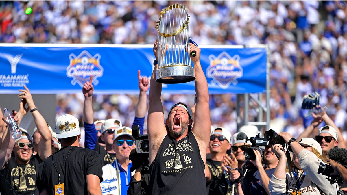 Clayton Kershaw lifts world series trophy