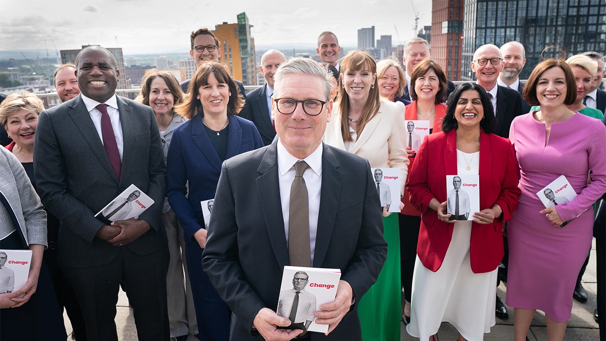 Labour Party leader Keir Starmer poses with shadow cabinet officials before the 2024 general election. 