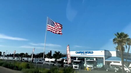 Camping World CEO defies another city’s threat of legal action over huge American flag: Not ‘coming down’