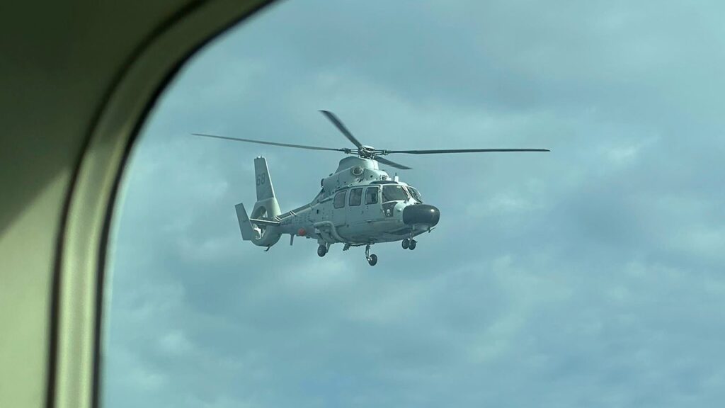 Chinese navy helicopter flies within 10 feet of Philippine patrol plane over disputed shoal