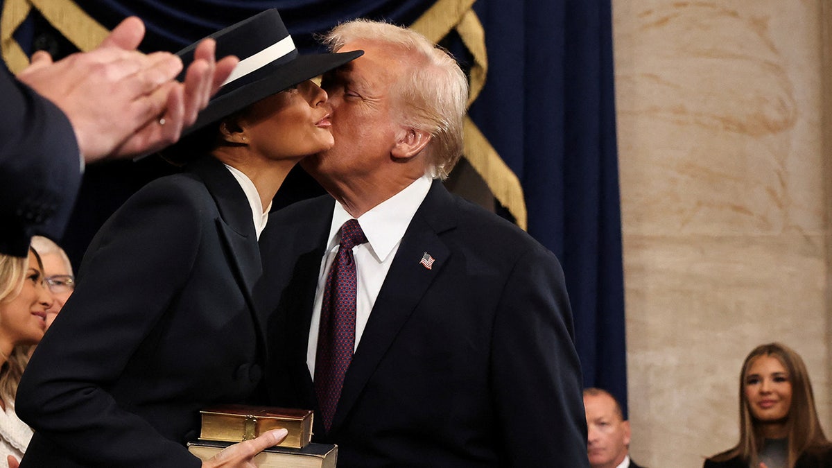 U.S. President-elect Donald Trump greets Melania Trump as he arrives for inauguration ceremonies