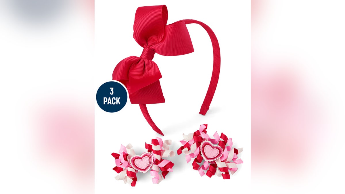 This 3-piece Gymboree set featuring heart headbands and festive barrettes is a simple way to add Valentine’s flair without committing to a full outfit. 