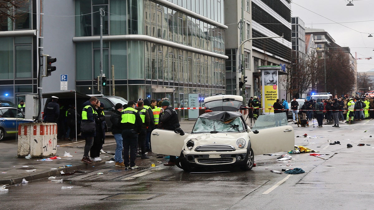 Police gather near a car in Munich