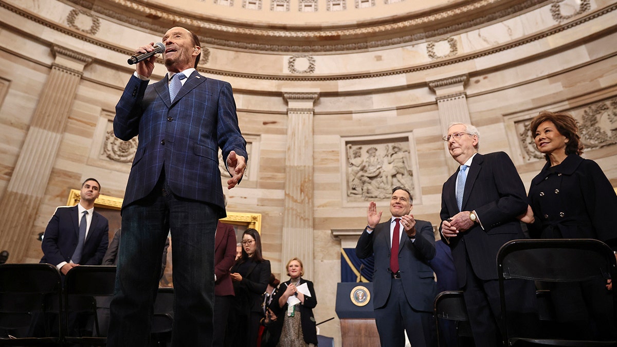 Lee Greenwood performs in the Rotunda in front of Senator Mitch McConnell and his wife