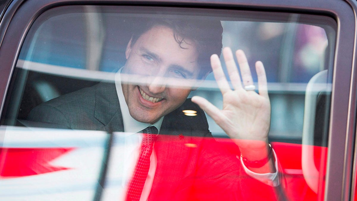 FILE - Prime Minister Justin Trudeau waves as he leaves the offices of Salesforce on Feb. 8, 2018, in San Francisco. (Ryan Remiorz/The Canadian Press via AP, File)