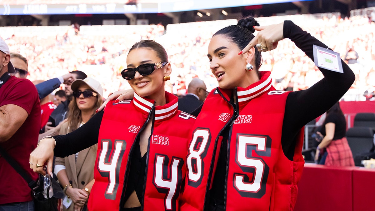 Kristin Juszczyk and Claire Kittle sideline