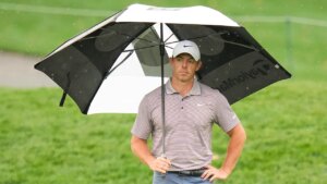 Rory McIlroy leads at The Players Championship as inclement weather suspends play