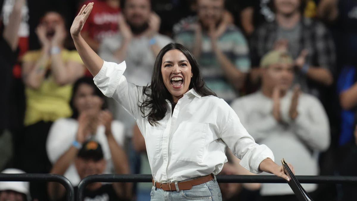 Rep. Alexandria Ocasio-Cortez, D-N.Y., arrives to speak during a "Fighting Oligarchy" tour event at Arizona State University, Thursday, March 20, 2025, in Tempe, Ariz. (AP Photo/Ross D. Franklin)