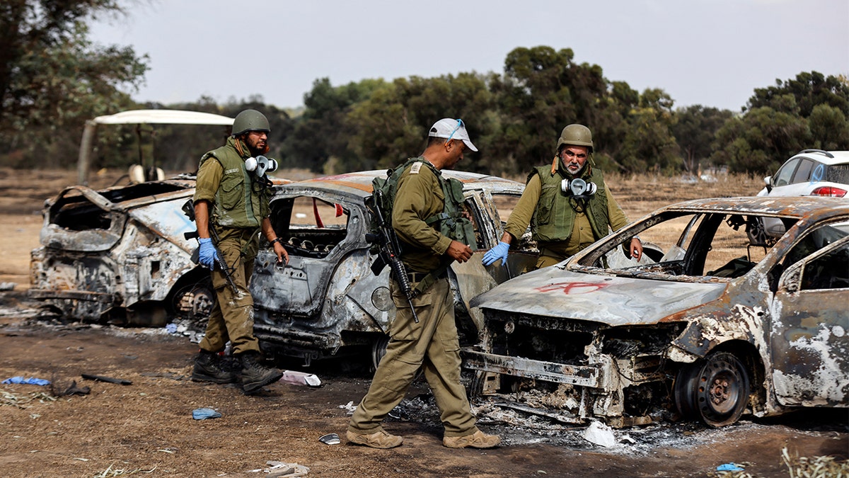 IDF soldiers inspect aftermath of Hamas attack on the Nova music festival