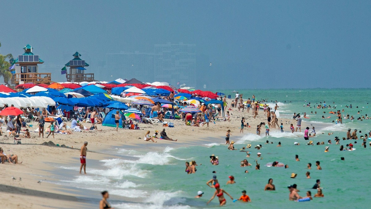 Beachgoers spend a sunny and hot day at Sunny Isles Beach as the coronavirus pandemic continues on Sunday, September 6, 2020 in Florida.