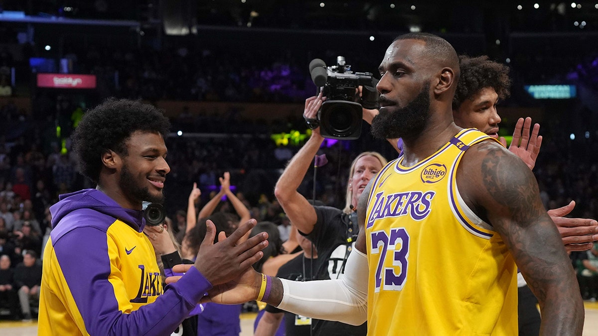 LeBron James interacts with Bronny James