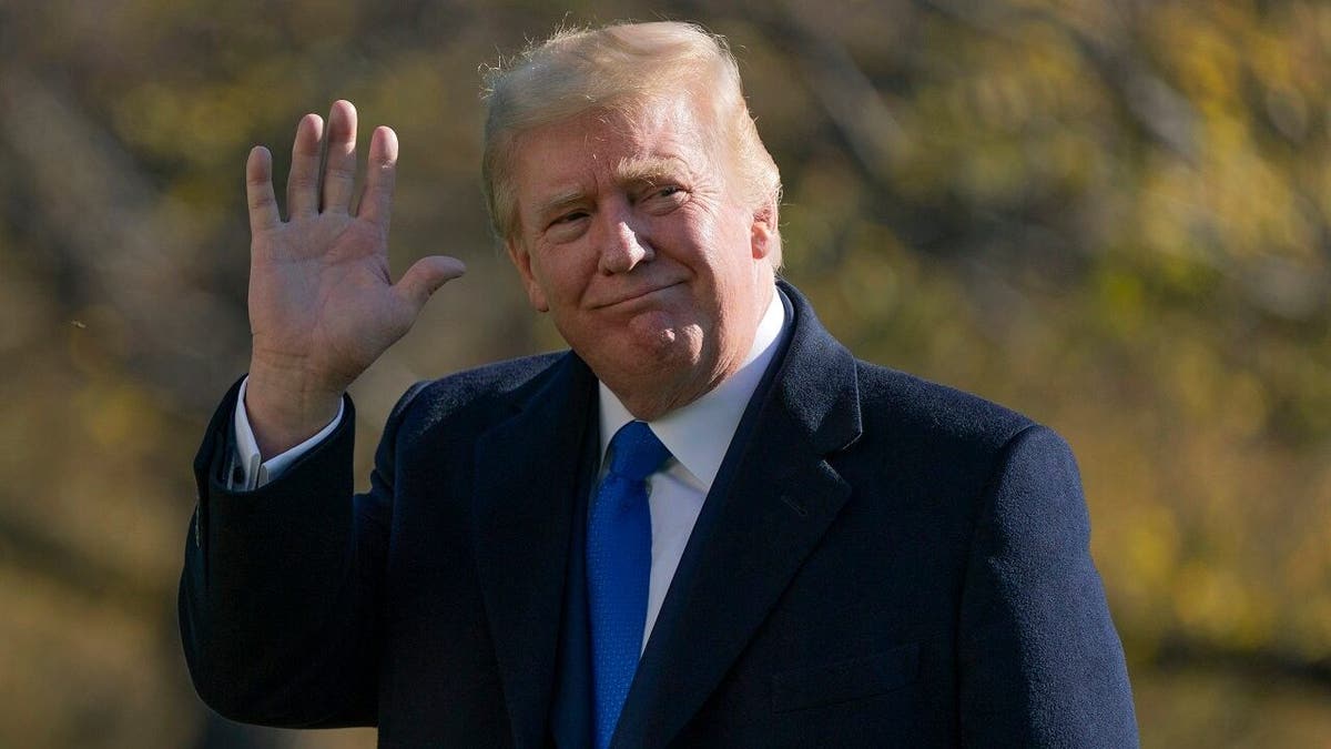 President Donald Trump waves