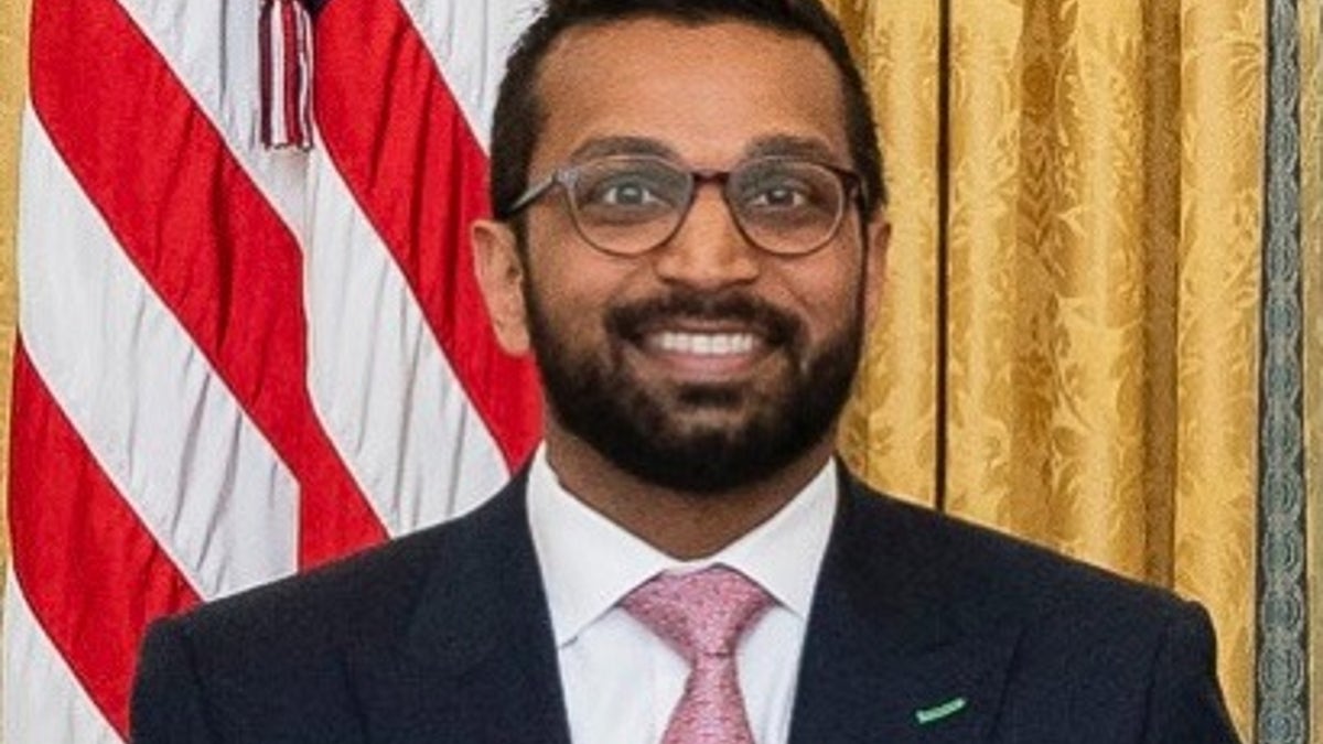 Kash Patel headshot with US flag