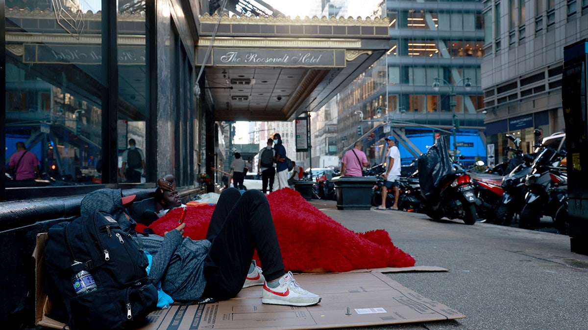 Migrants sleep on the street in New York City