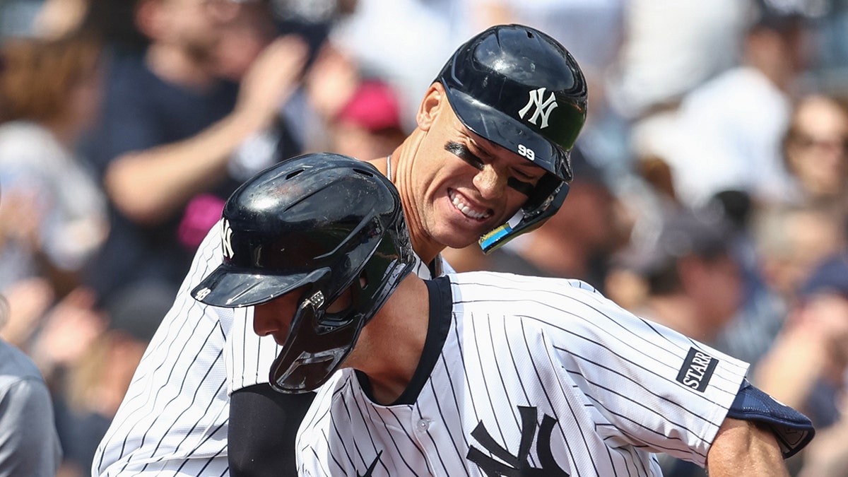 Aaron Judge and Paul Goldschmidt celebrate