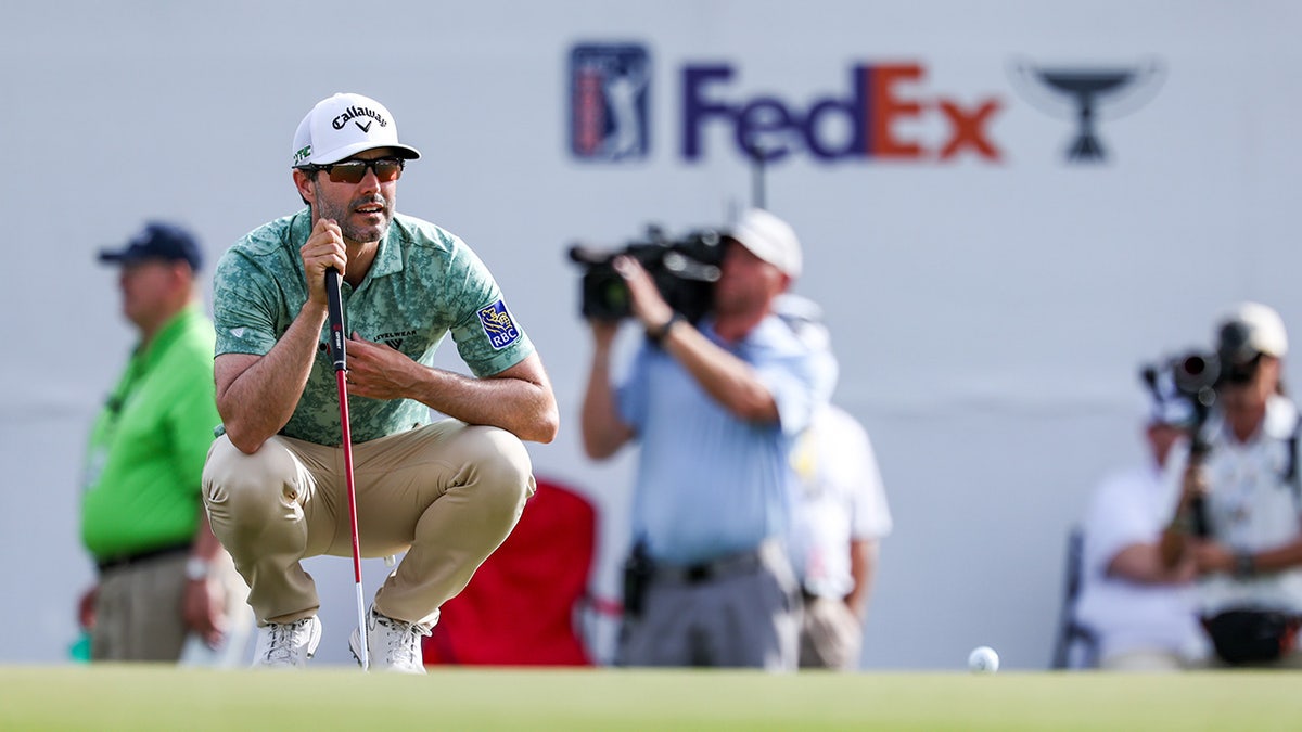 Adam Hadwin looks over putt