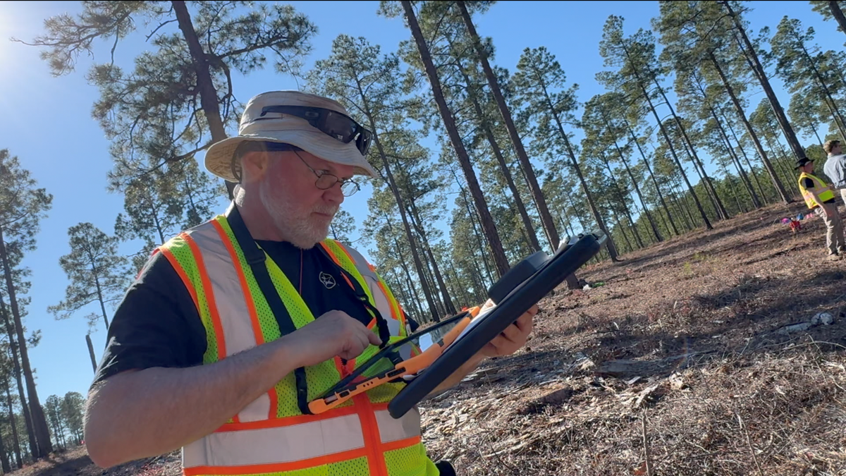 Veteran looking at GPS tracker