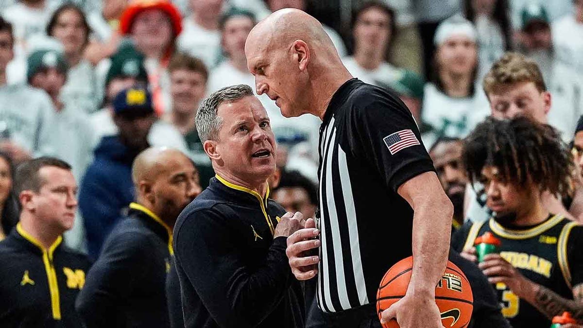 Dusty May talks to referee