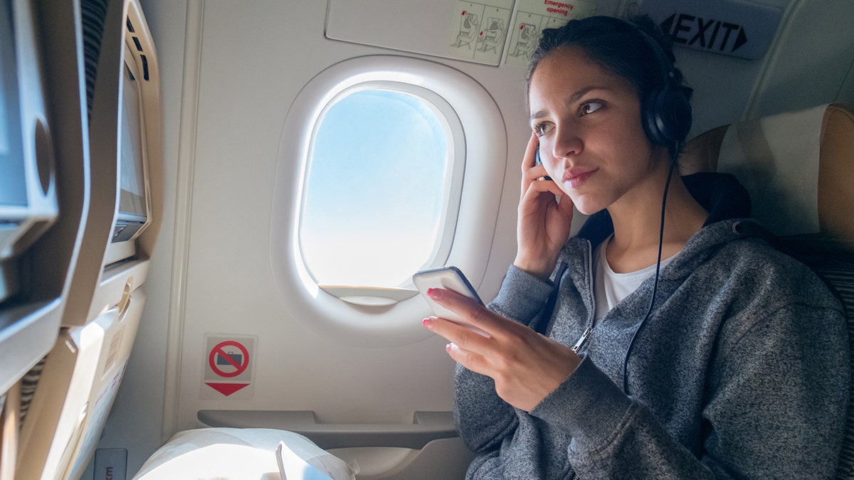 flight passenger listening to music