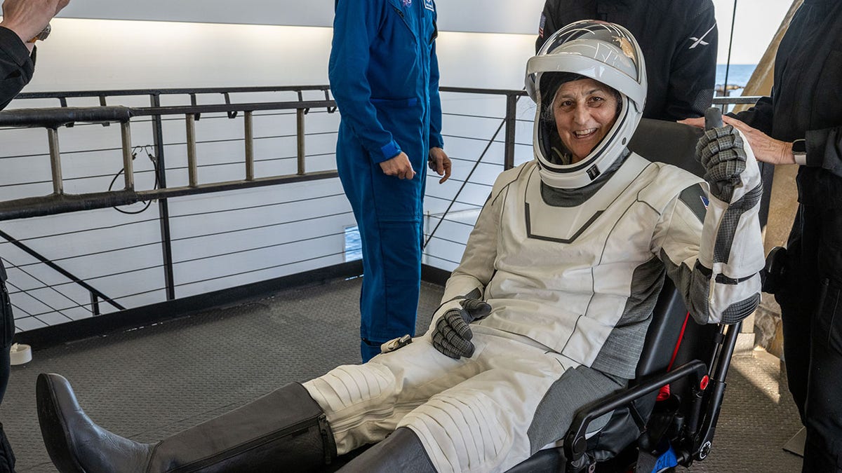 Suni Williams is wheeled out of the SpaceX Dragon