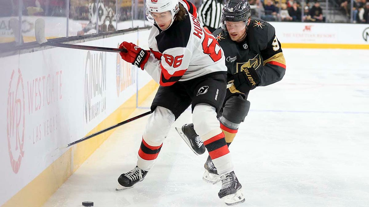 Jack Hughes goes after the puck