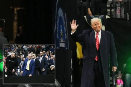 Trump greeted with huge cheers from ecstatic crowd as he attends NCAA wrestling championships