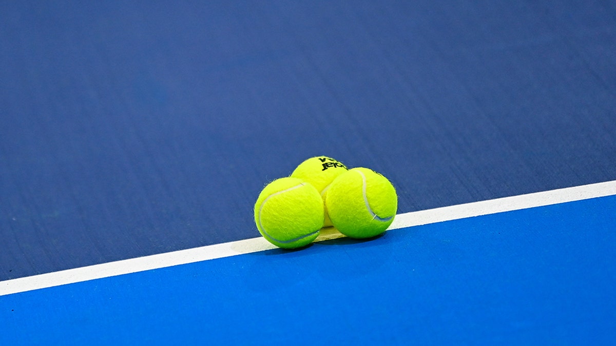 Tennis balls on court