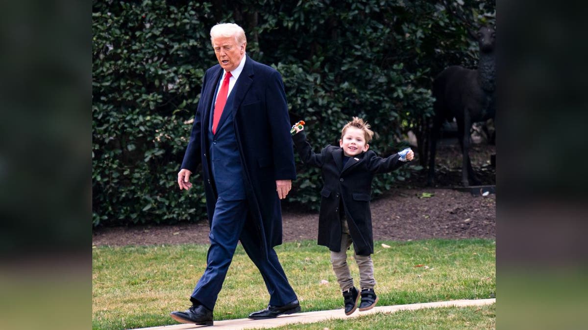 President Donald Trump and Elon Musk's son, "Lil X," on the South Lawn on March 14, 2025 in Washington, DC. Trump was headed to Mar-a-lago in Palm Beach, Florida for the weekend.