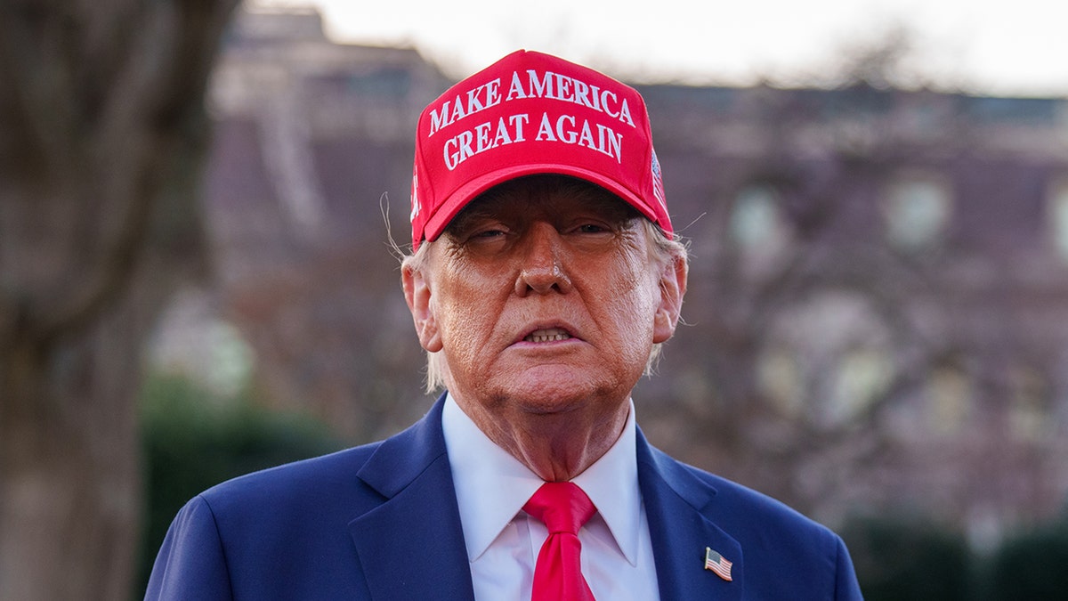 President Donald Trump wearing a "MAKE AMERICA GREAT AGAIN" hat