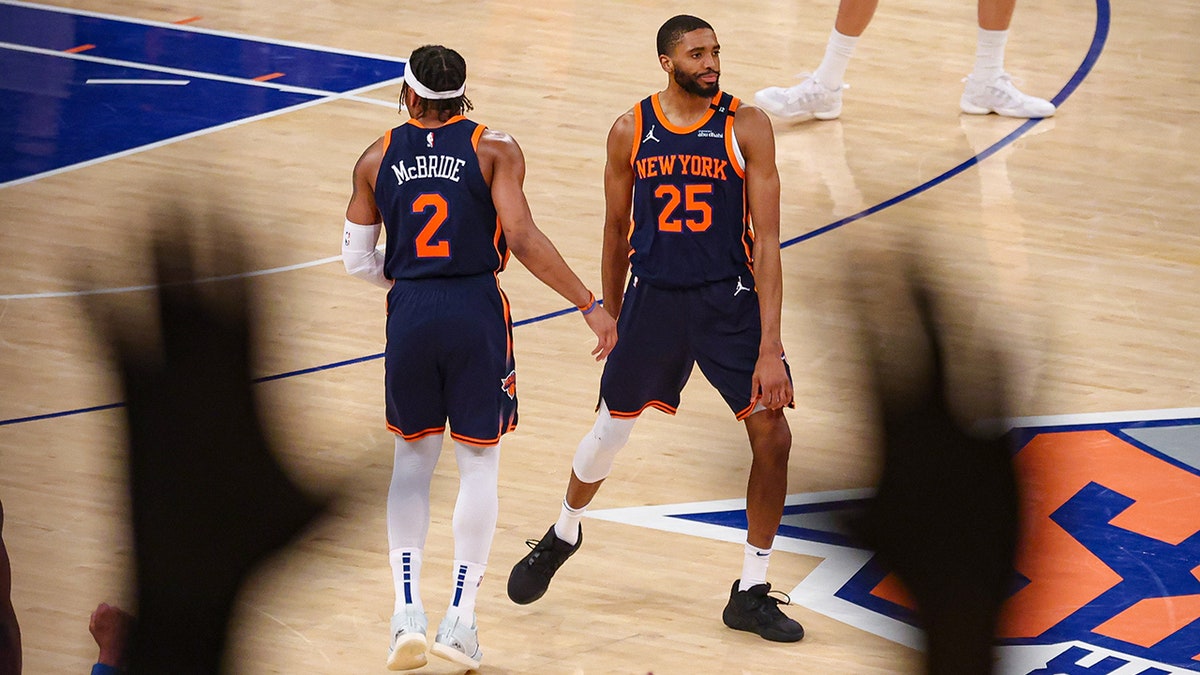 Mikal Bridges and Miles McBride celebrate