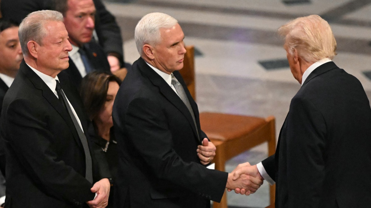 Pence shaking Trump's hand at Carter funeral