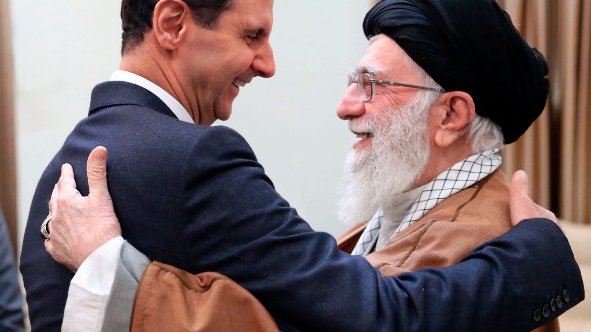 Supreme Leader Ayatollah Ali Khamenei, right, greets the then-Syrian President Bashar Assad in Tehran, Iran, on Feb. 25, 2019.