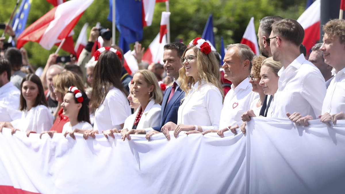 In Warsaw, Poland, on May 25, 2025, Donald Tusk, Prime Minister of Poland, participates in the ''Great Patriotic March'' organized in support of Rafal Trzaskowski, Civic Platform candidate for President of Poland. The march takes place through the streets of the capital. The Great Patriotic March, organized to show support for Civic Platform candidate Rafal Trzaskowski in the presidential election, proceeds through the streets of the capital. Polish Prime Minister Donald Tusk and the visiting President-elect of Romania, Nicusor Dan, attend the march. Some of the other candidates also participate. Rafal Trzaskowski faces Karol Nawrocki, supported by Law and Justice, in the second round of the election on June 1. 