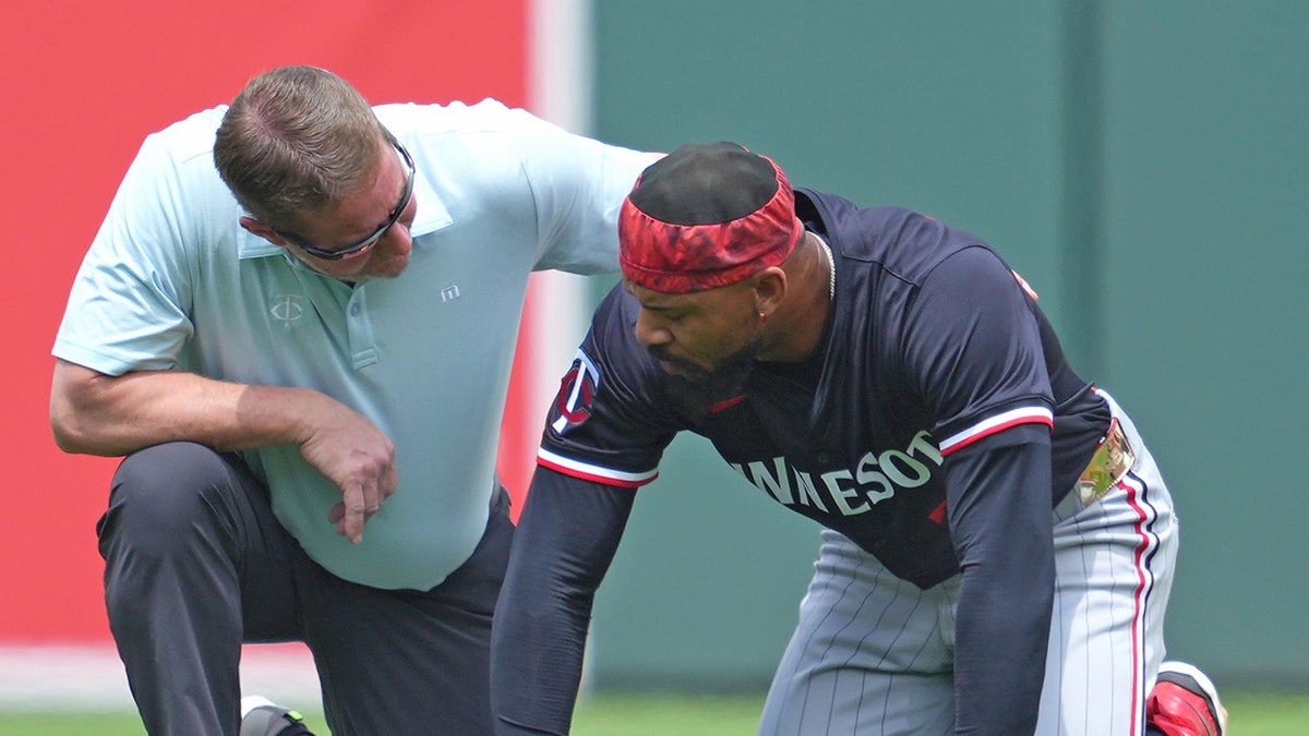 Byron Buxton with trainer
