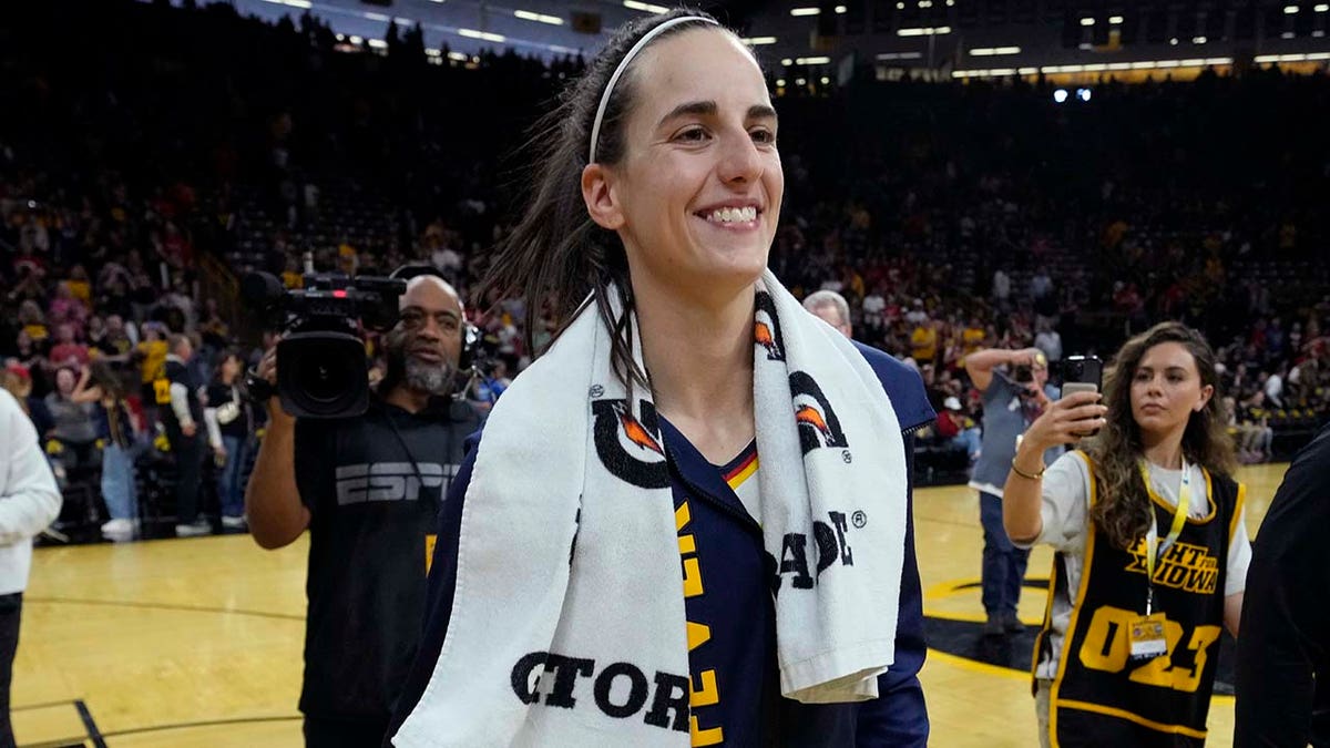 Caitlin Clark smiles after preseason game