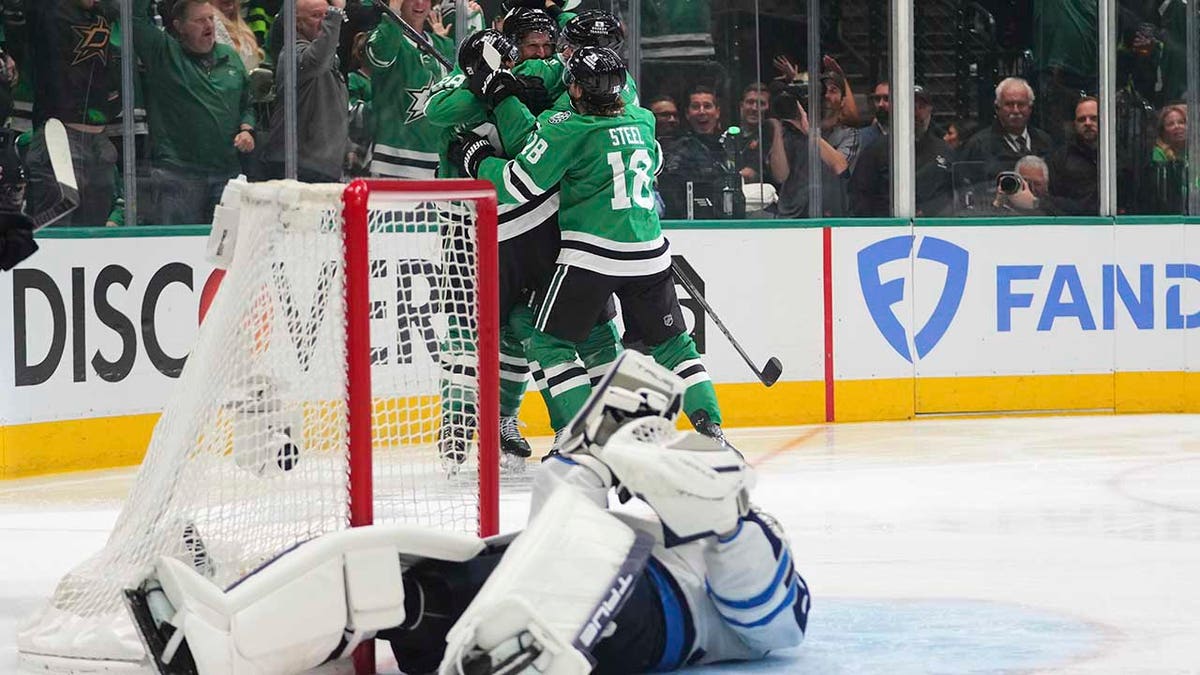 Jets goalie on his back
