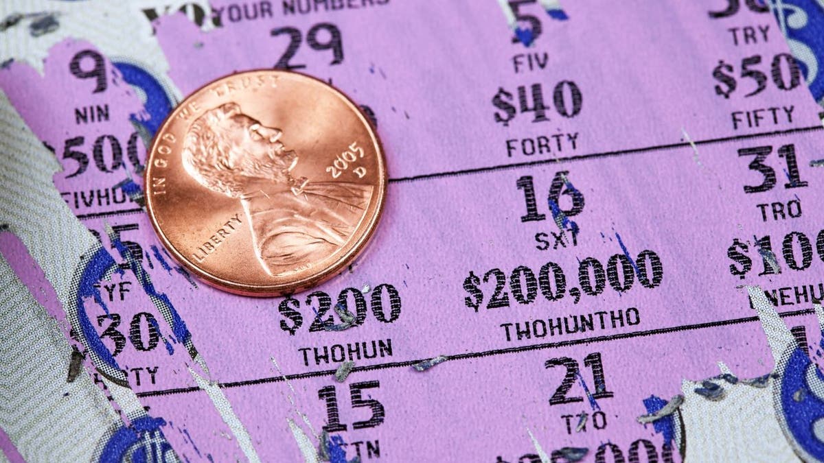 Lottery scratcher with penny