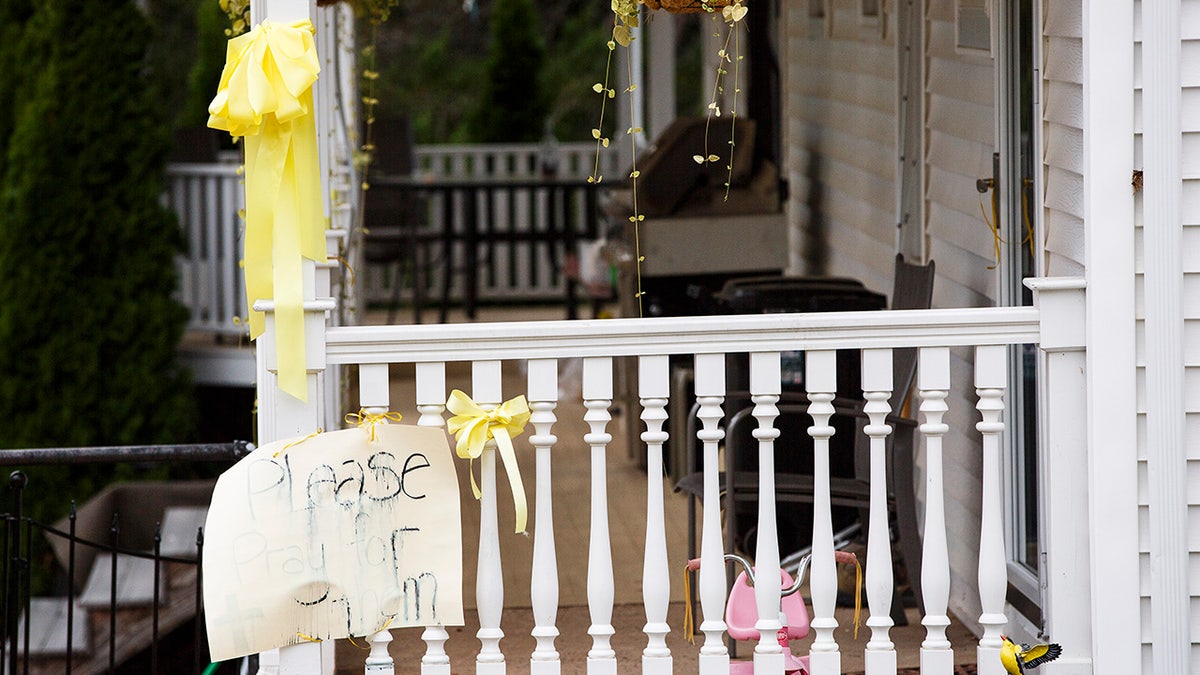 Signs outside a home wishing for Nathan and Linda's safe return home.