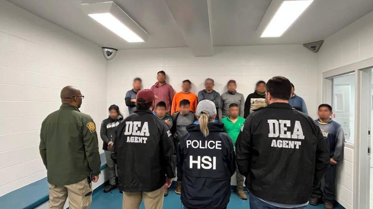 ICE agents with illegal immigrants