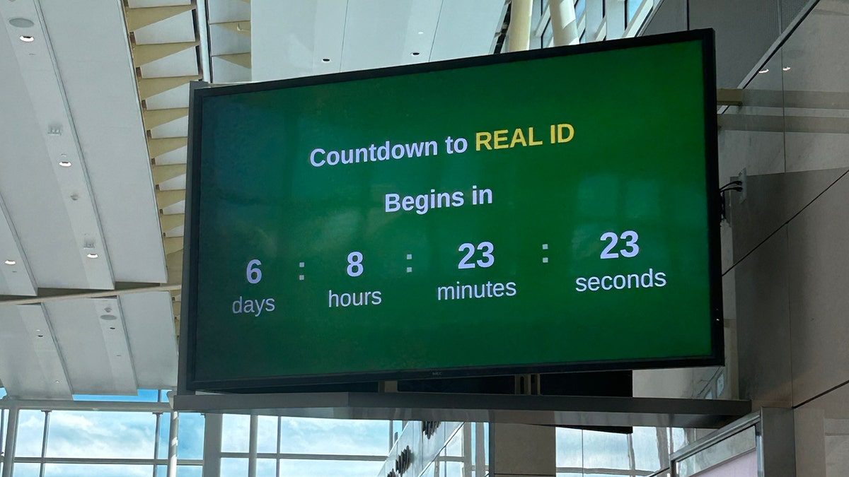 Countdown screen on a green background. There is a big title above the countdown clock saying "COUNTDOWN TO REAL ID BEGINS:"