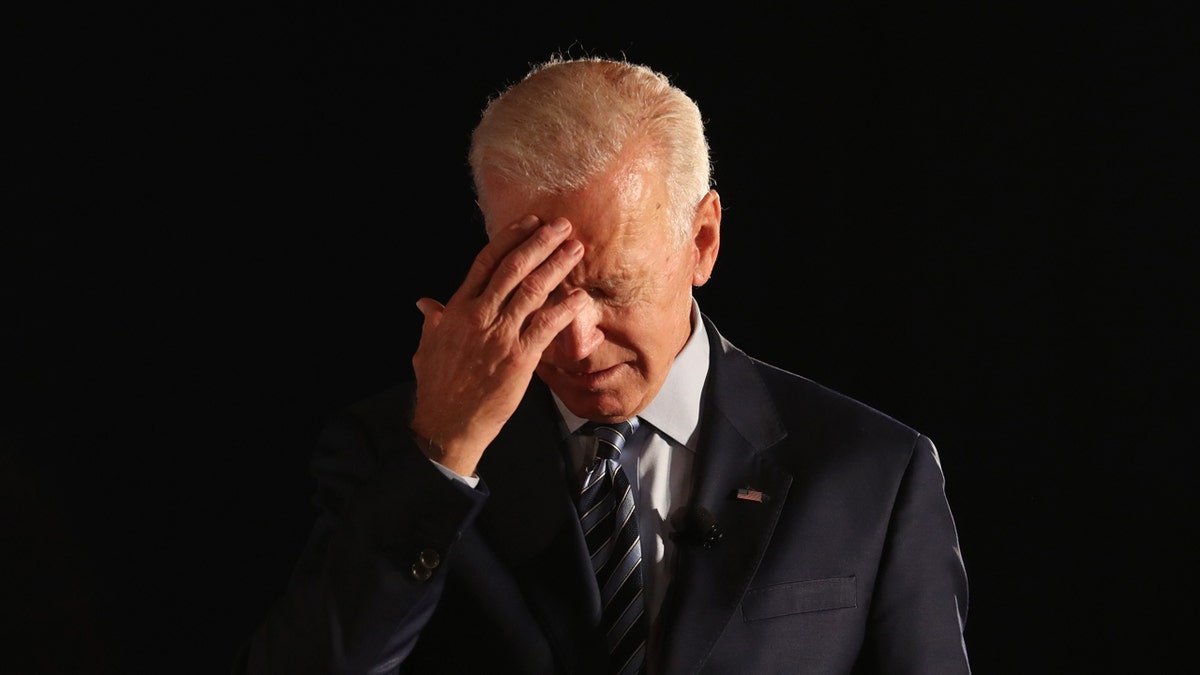 Joe Biden against a dark background