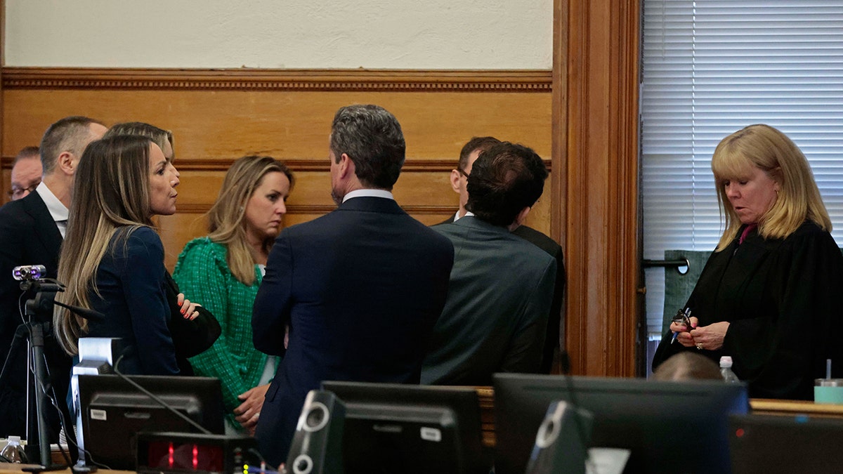 Karen Read, lawyers and judge talk in court.