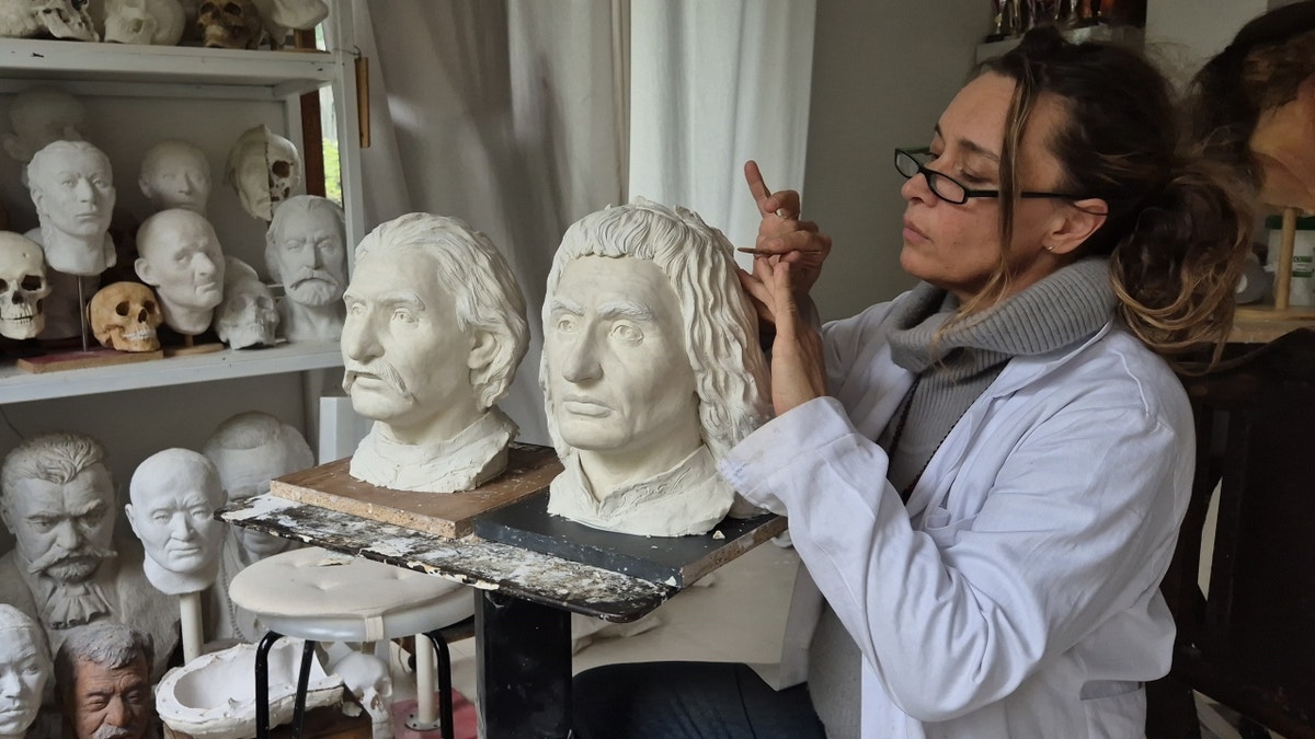 Emese Gábor works on facial reconstructions