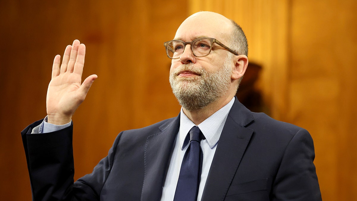 President Donald Trump's nominee for Office of Management and Budget Director Russell Vought is sworn in during the Senate Banking Committee nomination hearing in the Dirksen Senate Building on January 22, 2025 in Washington, DC